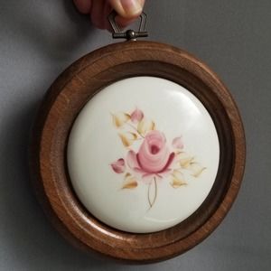 Round wood framed ceramic wall